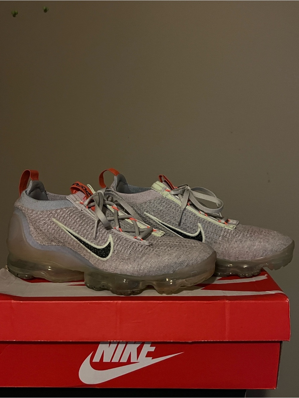 Nike Women Light Gray and Black VaporMax Flyknit Sneakers with Orange Accents